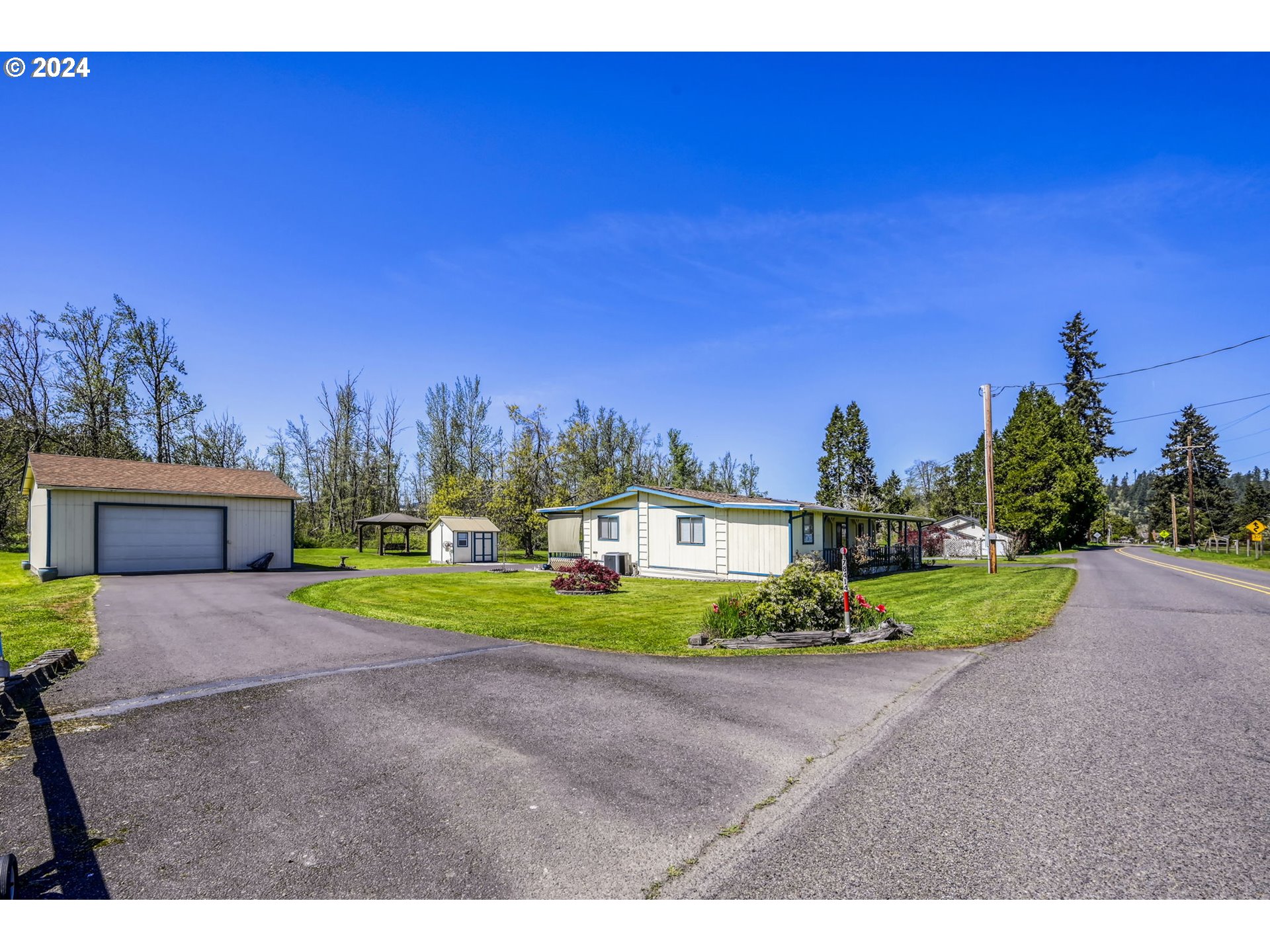 78414 Sears Road Cottage Grove, OR 97424 - Photo 2 of 44 a view of a house with a yard and street