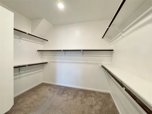 a view of an empty walk in closet