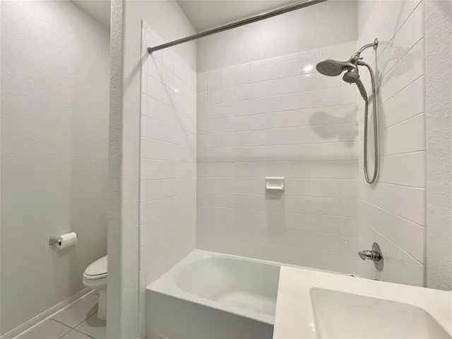 a bathroom with a bathtub and a toilet
