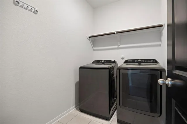 a utility room with washer and dryer