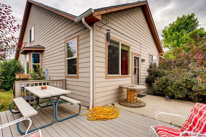 8068 Raspberry Drive Frederick, CO 80504 - Photo 25 of 26 a view of a dinning table and chairs in patio of the house