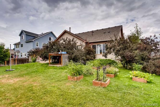 8068 Raspberry Drive Frederick, CO 80504 - Photo 26 of 26 a front view of a house with a yard