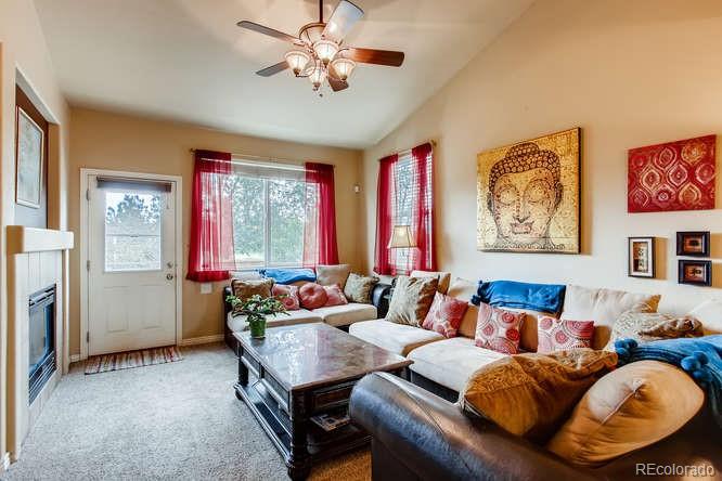 8068 Raspberry Drive Frederick, CO 80504 - Photo 5 of 26 a living room with furniture and a large window