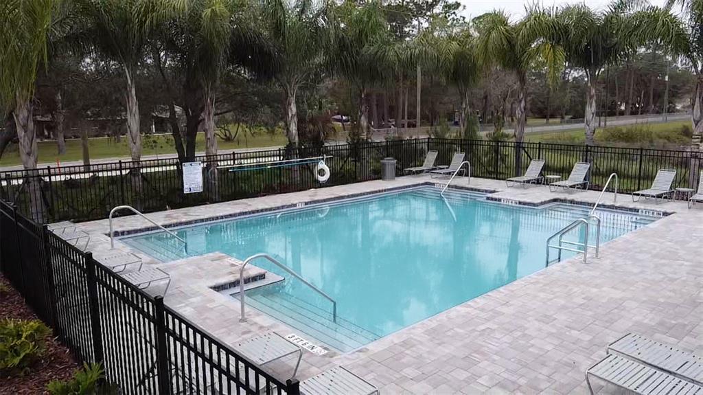 2802 Silver Canoe Drive Edgewater, FL 32141 - Photo 5 of 5 a view of a swimming pool with a patio