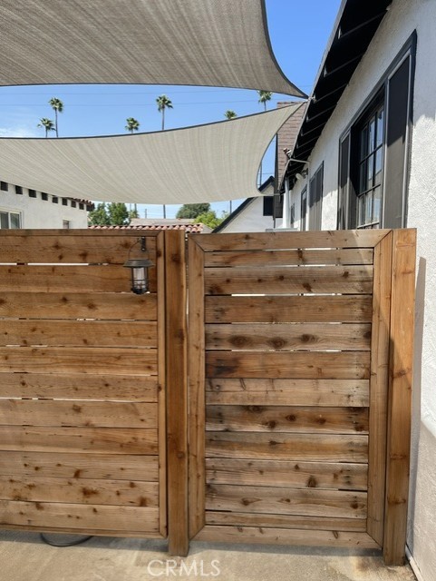 4351 Beatty Drive Riverside, CA 92506 - Photo 6 of 16 Enter through the front wooden gate