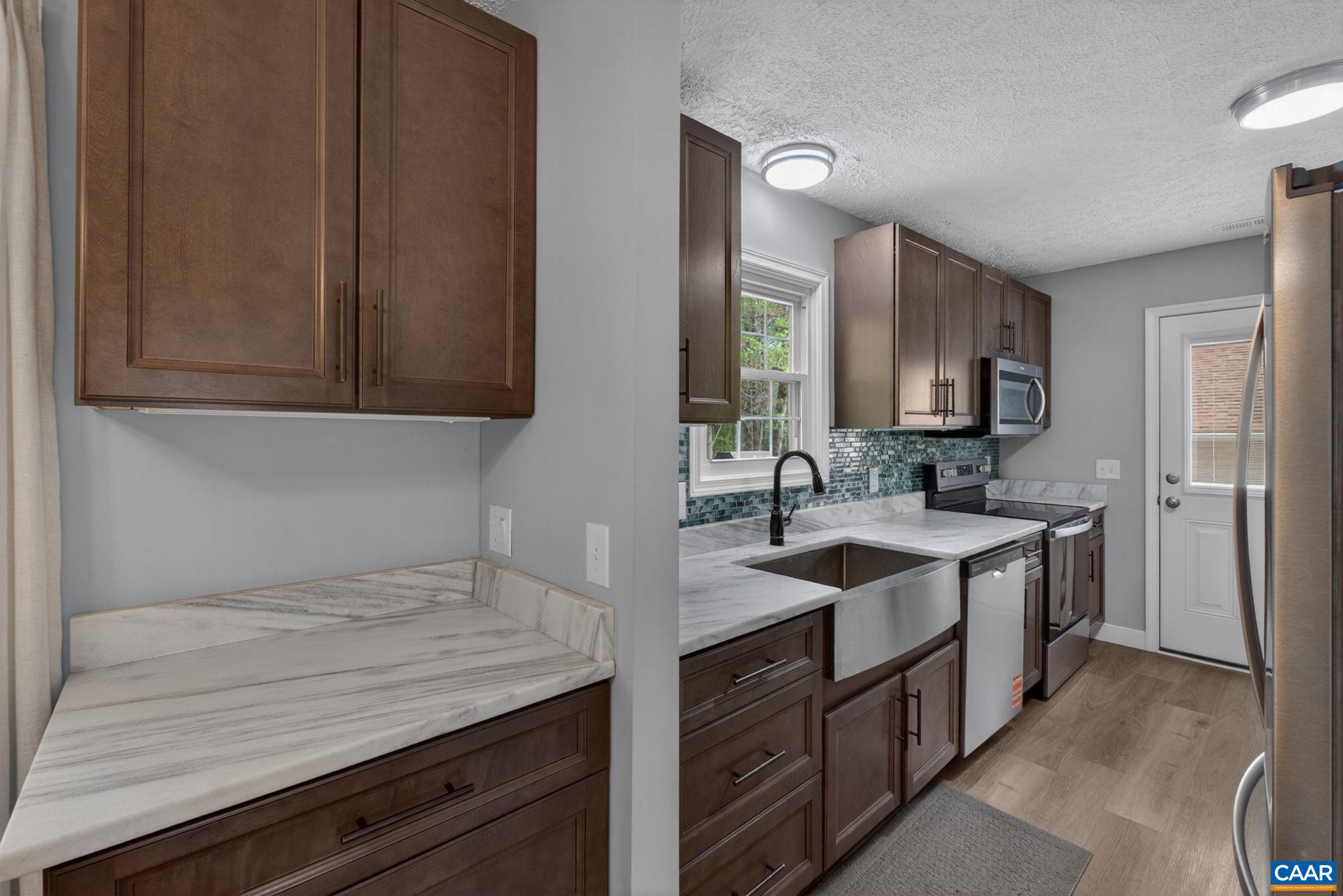 673 Cedar Lane Road Palmyra, VA 22963 - Photo 14 of 47 a kitchen with a sink stove and cabinets