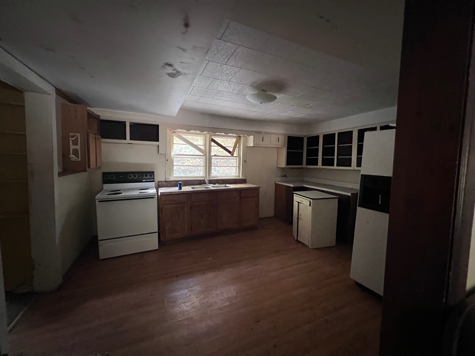 235 Ernest Looper Road Rickman, TN 38580 - Photo 4 of 16 a kitchen with stainless steel appliances granite countertop a refrigerator a sink a stove top oven a counter space and cabinets