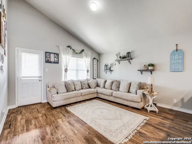 a living room with furniture and a rug