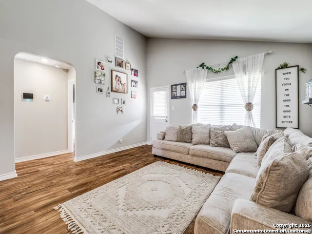 a living room with furniture and a rug