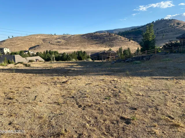 a view of a yard with an ocean view