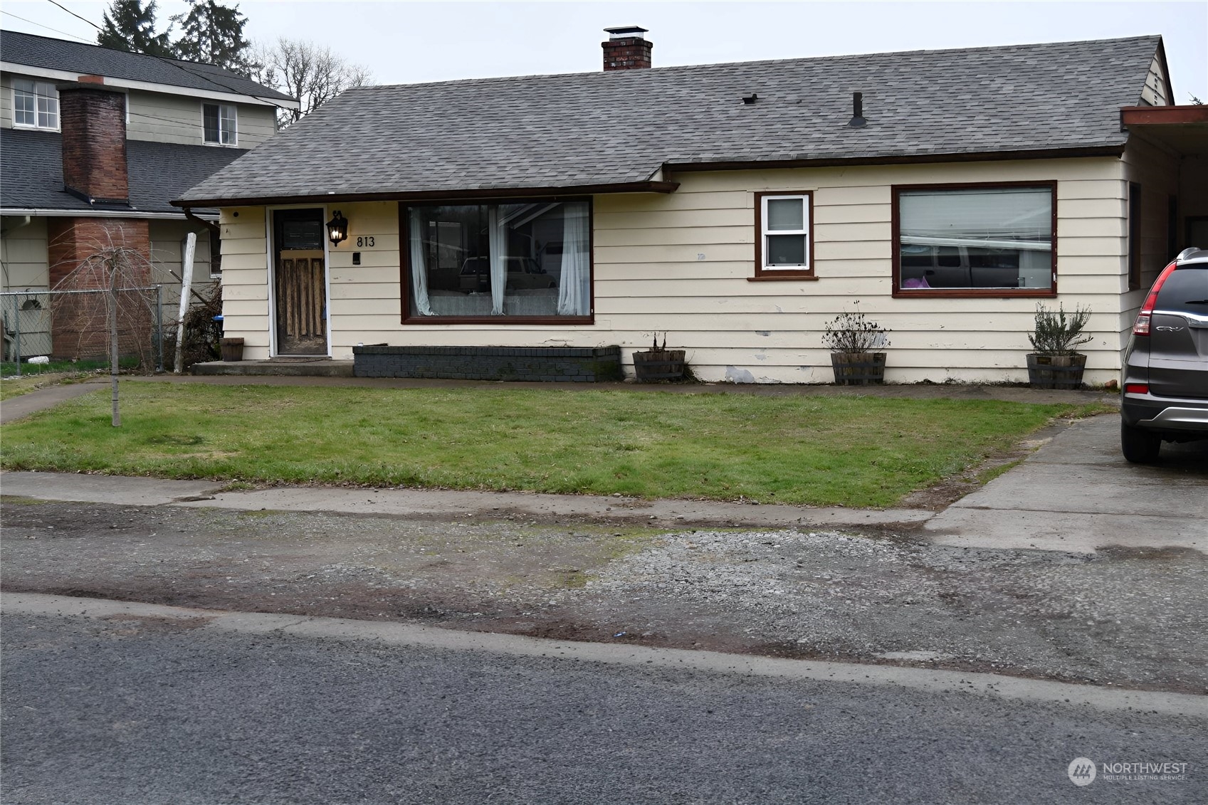 813 Southwest 19th Street Chehalis, WA 98532 - Photo 1 of 17 a front view of a house with a garden