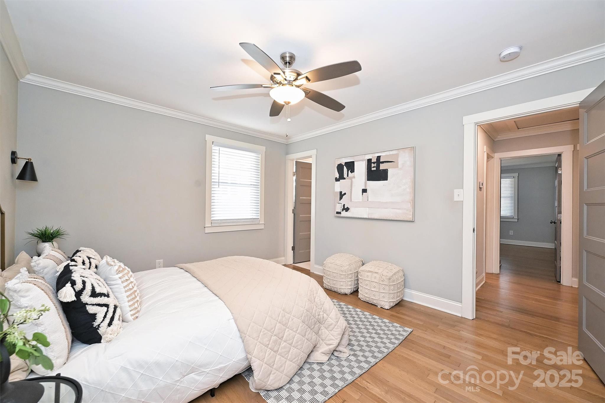 532 Scaleybark Road Charlotte, NC 28209 - Photo 13 of 29 a bedroom with a bed and a chandelier