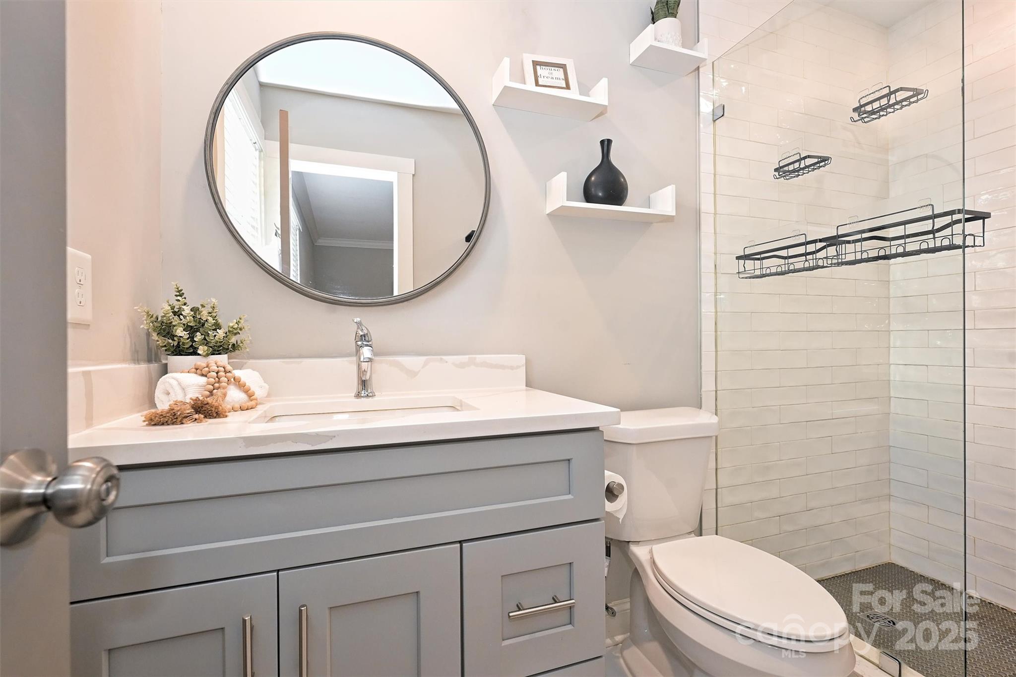 532 Scaleybark Road Charlotte, NC 28209 - Photo 15 of 29 a bathroom with a sink a toilet and a mirror