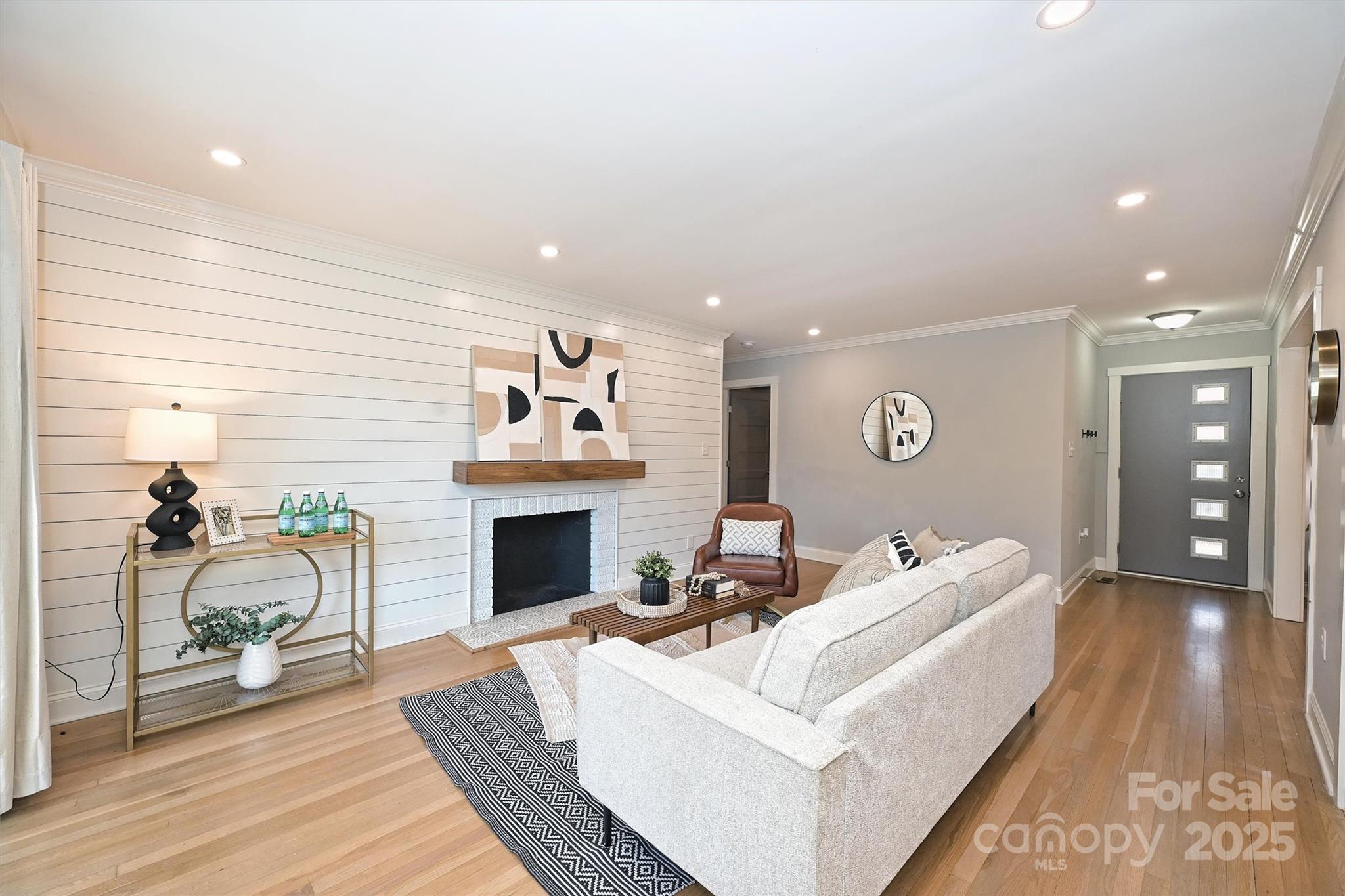 532 Scaleybark Road Charlotte, NC 28209 - Photo 7 of 29 a living room with furniture and a fireplace