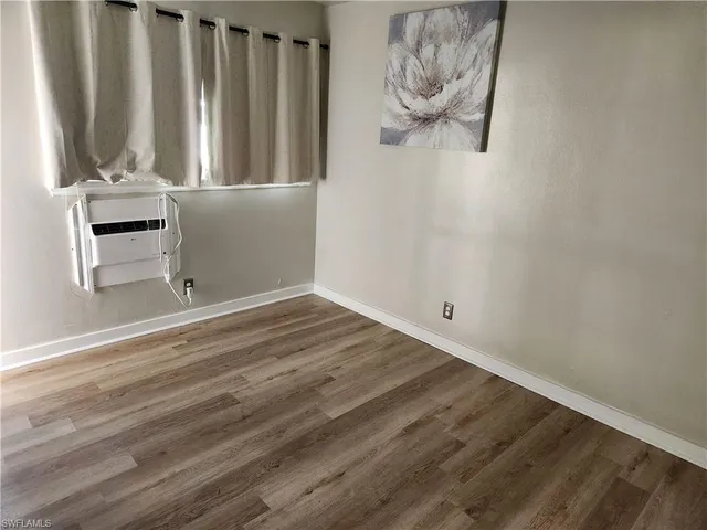 a view of wooden floor and chair in a room