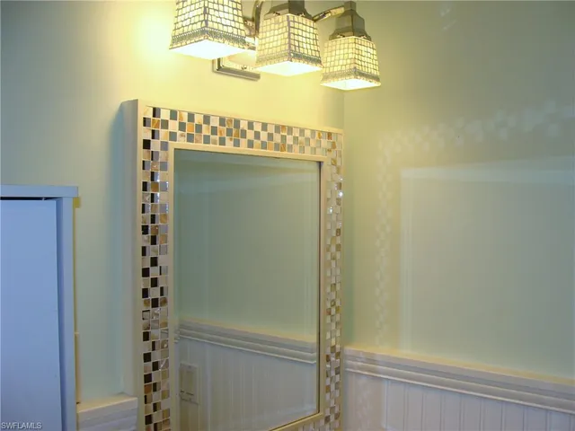 a bathroom with a mirror