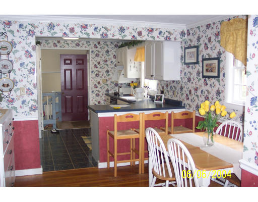 19 Chamberlain Road Chelmsford, MA 01824 - Photo 4 of 9 a view of a dining room with a table and chairs