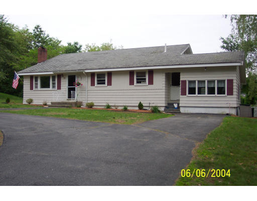 19 Chamberlain Road Chelmsford, MA 01824 - Photo 8 of 9 a front view of a house with a garden and yard