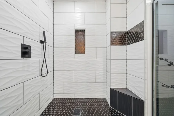 a bathroom with a bathtub and a sink