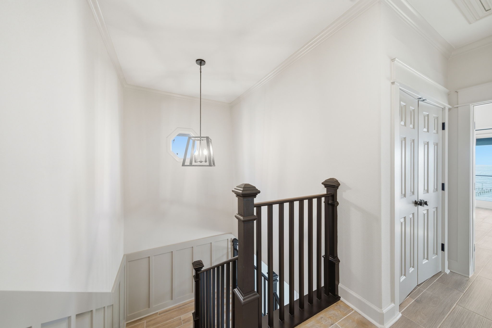 1918 Todville Road Seabrook, TX 77586 - Photo 22 of 41 Sleek modern staircase leads up to the third level, where three additional bedrooms and laundry closet are located.