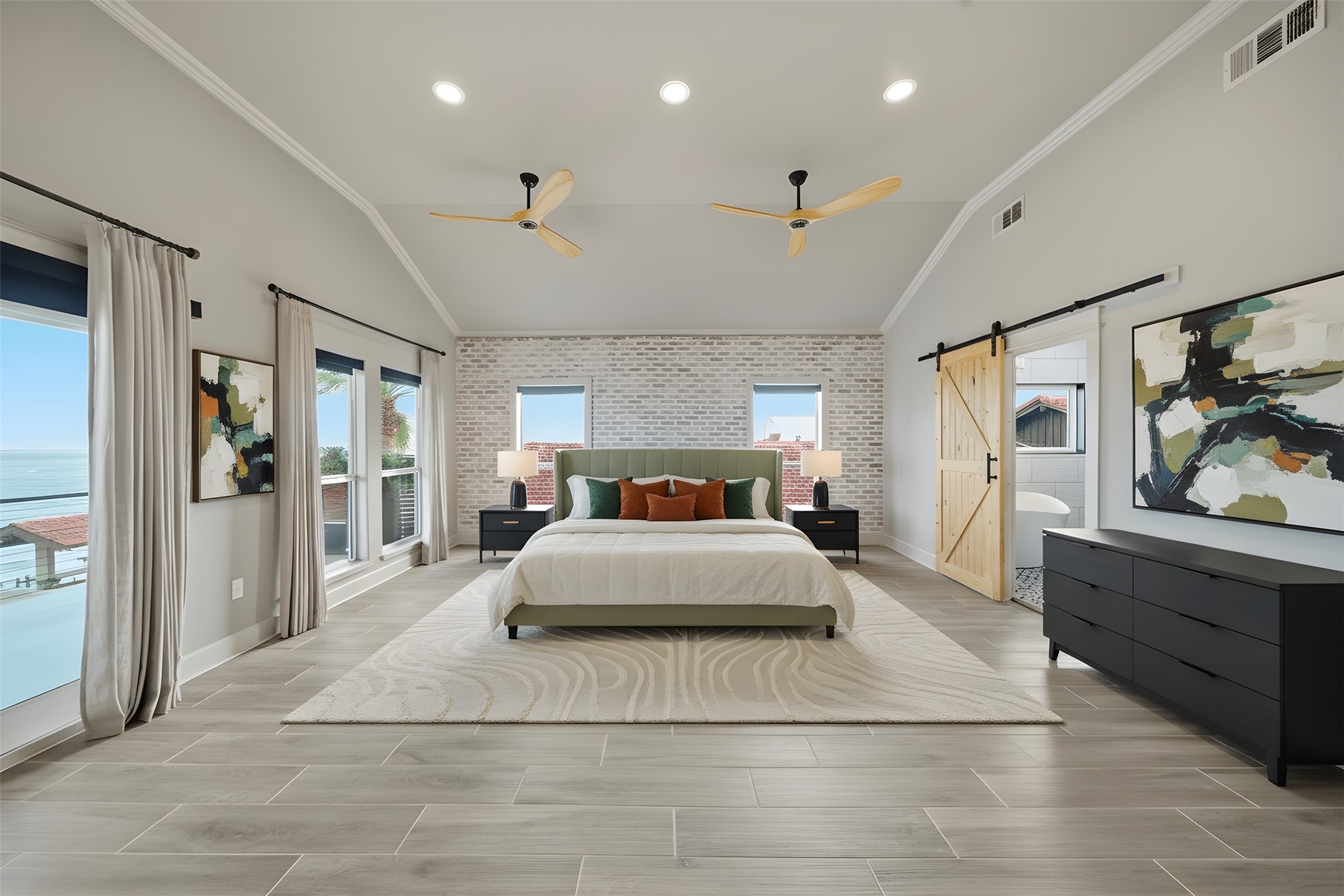 1918 Todville Road Seabrook, TX 77586 - Photo 28 of 41 a spacious bedroom with a large bed and a chandelier