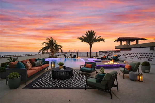 a view of a patio with a table and chairs with wooden floor