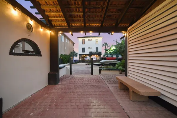a large kitchen with stainless steel appliances granite countertop a lot of counter space and a sink