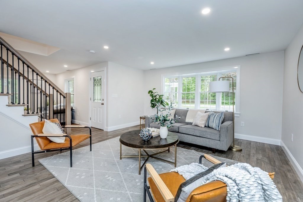 7 Elm Street North Reading, MA 01864 - Photo 15 of 42 a living room with furniture and a potted plant