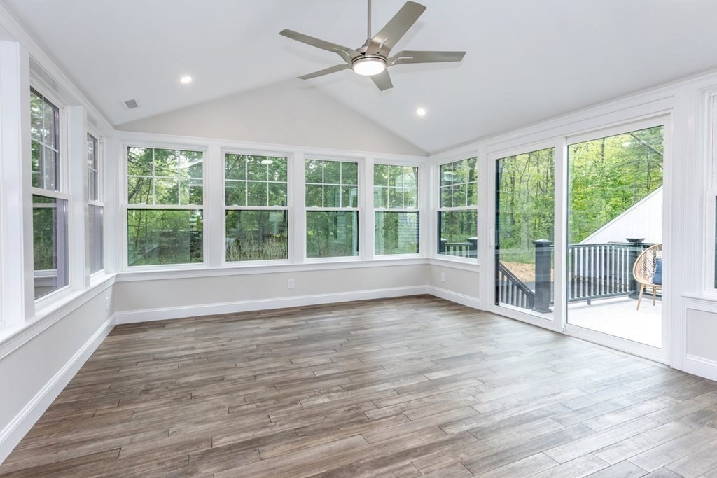 7 Elm Street North Reading, MA 01864 - Photo 17 of 42 a view of an empty room with wooden floor and a large window