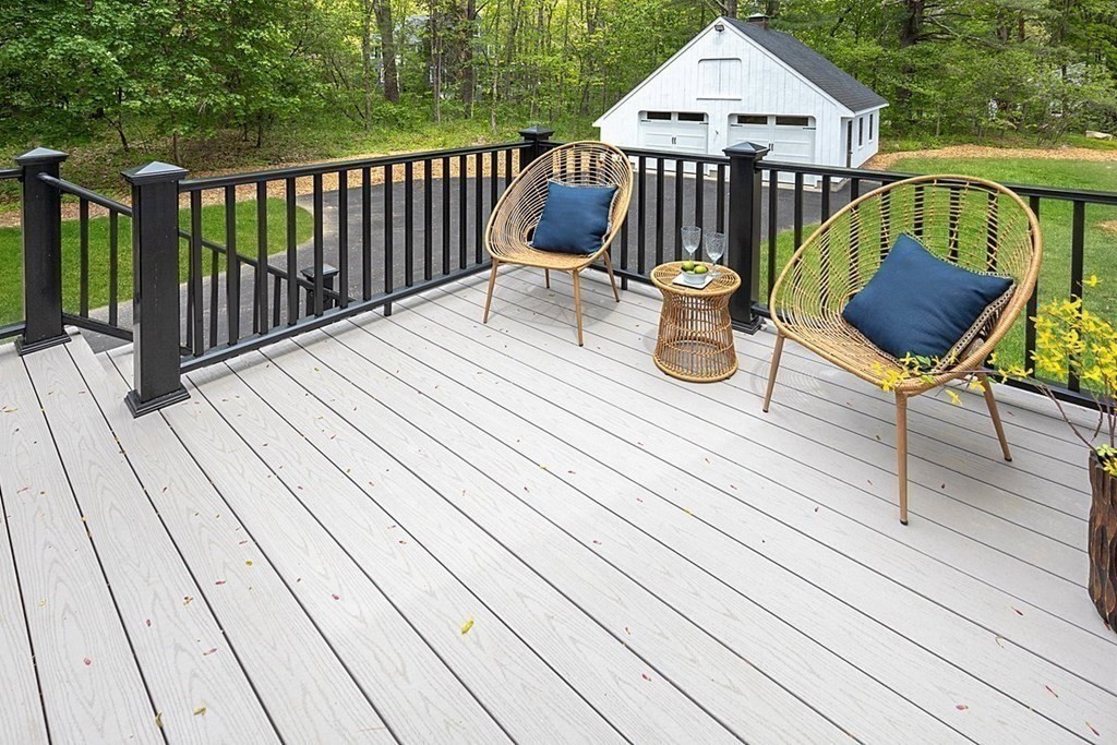 7 Elm Street North Reading, MA 01864 - Photo 19 of 42 a view of a deck with wooden floor and outdoor seating