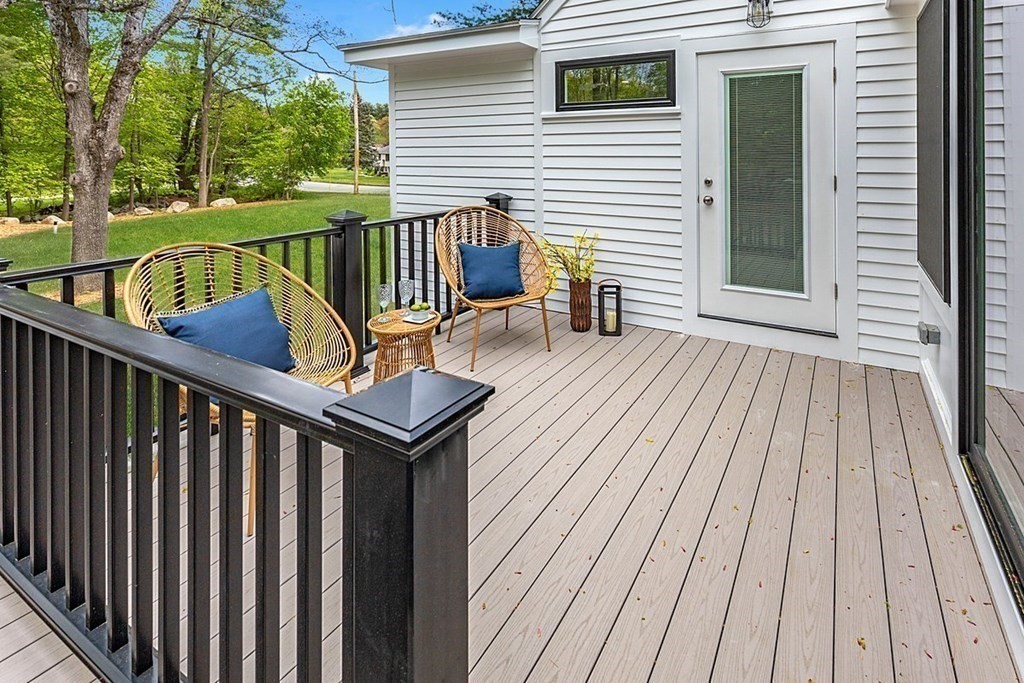 7 Elm Street North Reading, MA 01864 - Photo 20 of 42 a balcony with wooden floor outdoor seating and wooden floor
