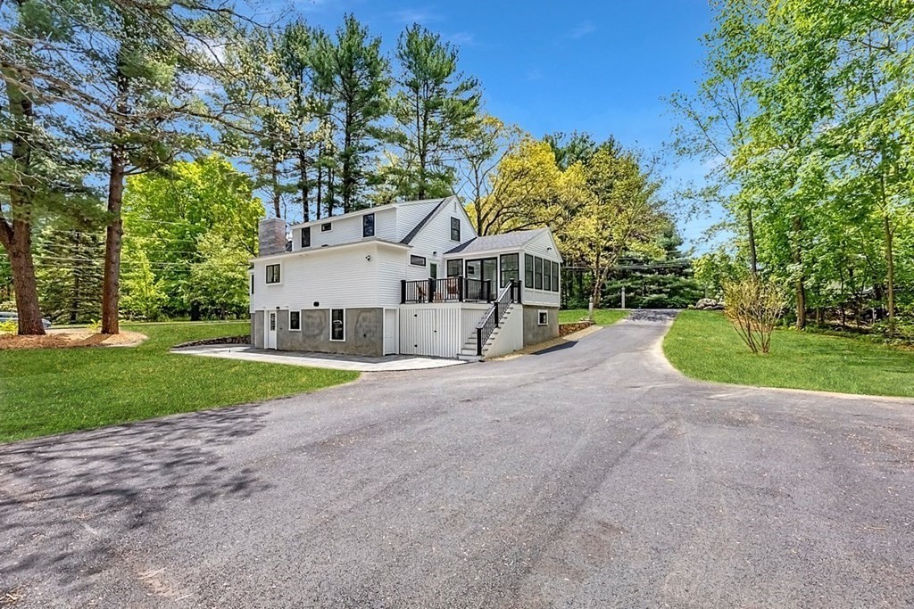 7 Elm Street North Reading, MA 01864 - Photo 2 of 42 a view of a house with a yard and pathway