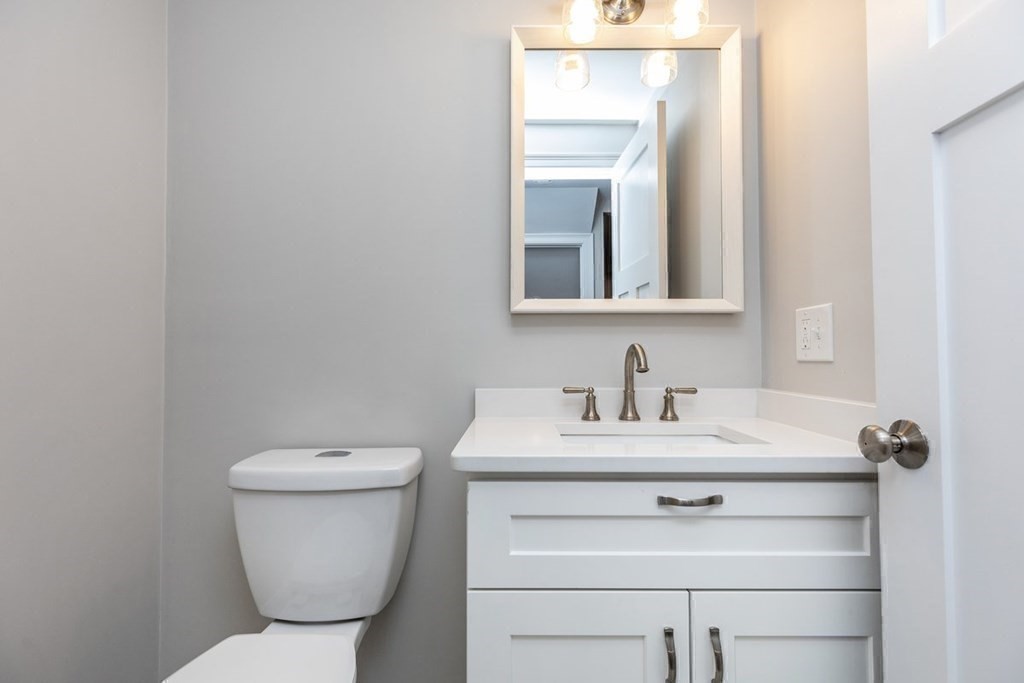 7 Elm Street North Reading, MA 01864 - Photo 21 of 42 a bathroom with a toilet sink and mirror