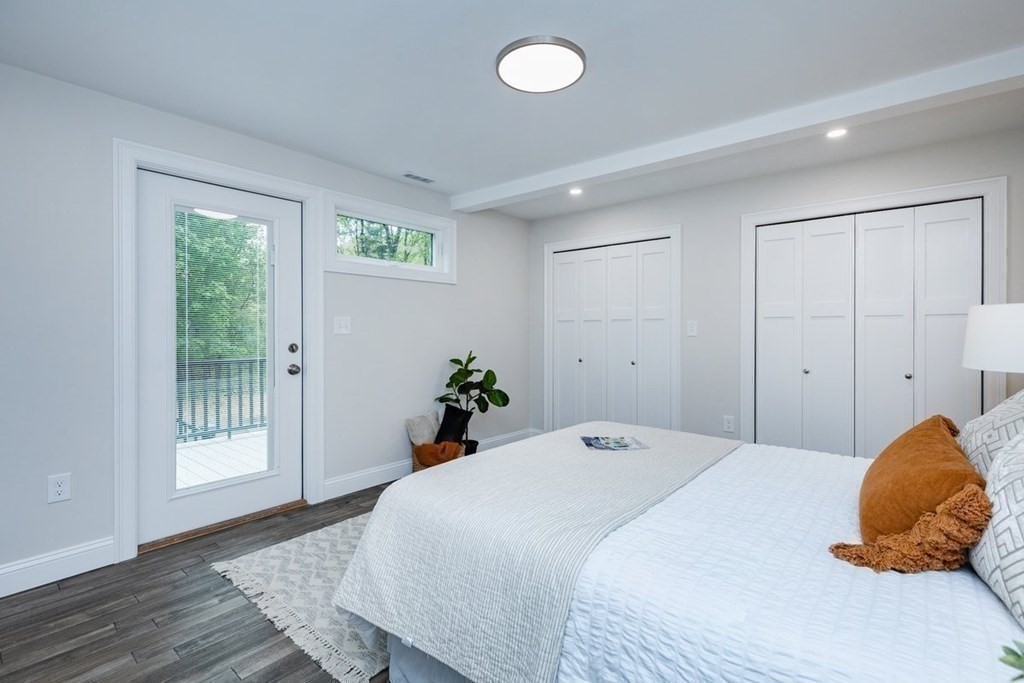 7 Elm Street North Reading, MA 01864 - Photo 23 of 42 a bedroom with a bed and wooden floor