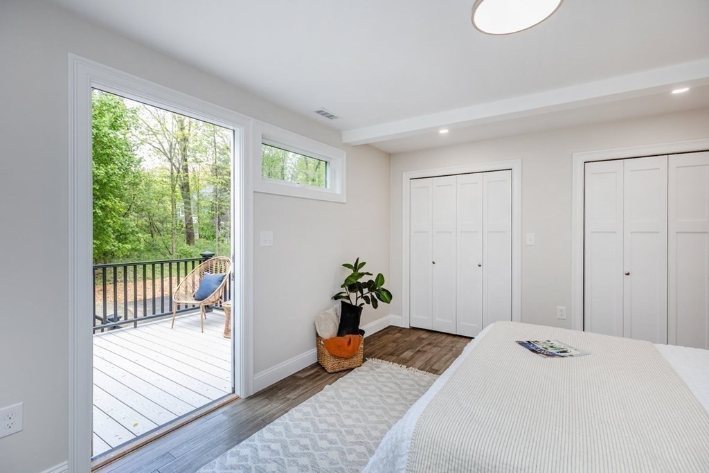 7 Elm Street North Reading, MA 01864 - Photo 24 of 42 a bedroom with a bed and wooden floor