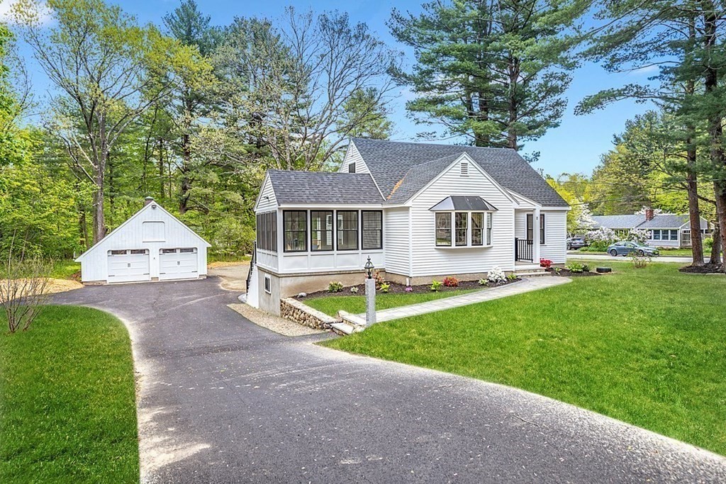 7 Elm Street North Reading, MA 01864 - Photo 3 of 42 a front view of a house with a yard and trees