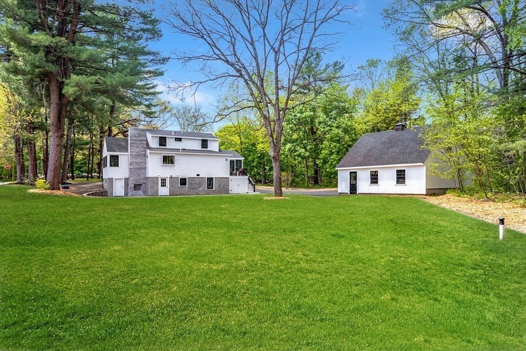 7 Elm Street North Reading, MA 01864 - Photo 39 of 42 a front view of a house with garden