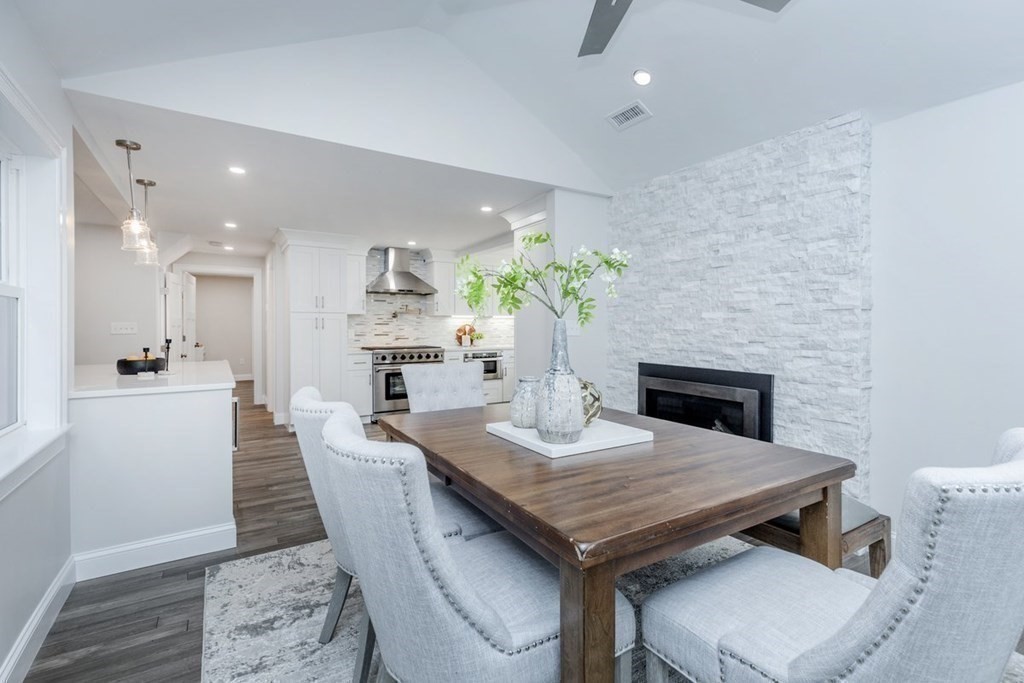 7 Elm Street North Reading, MA 01864 - Photo 10 of 42 a dining room with furniture wooden floor and a kitchen