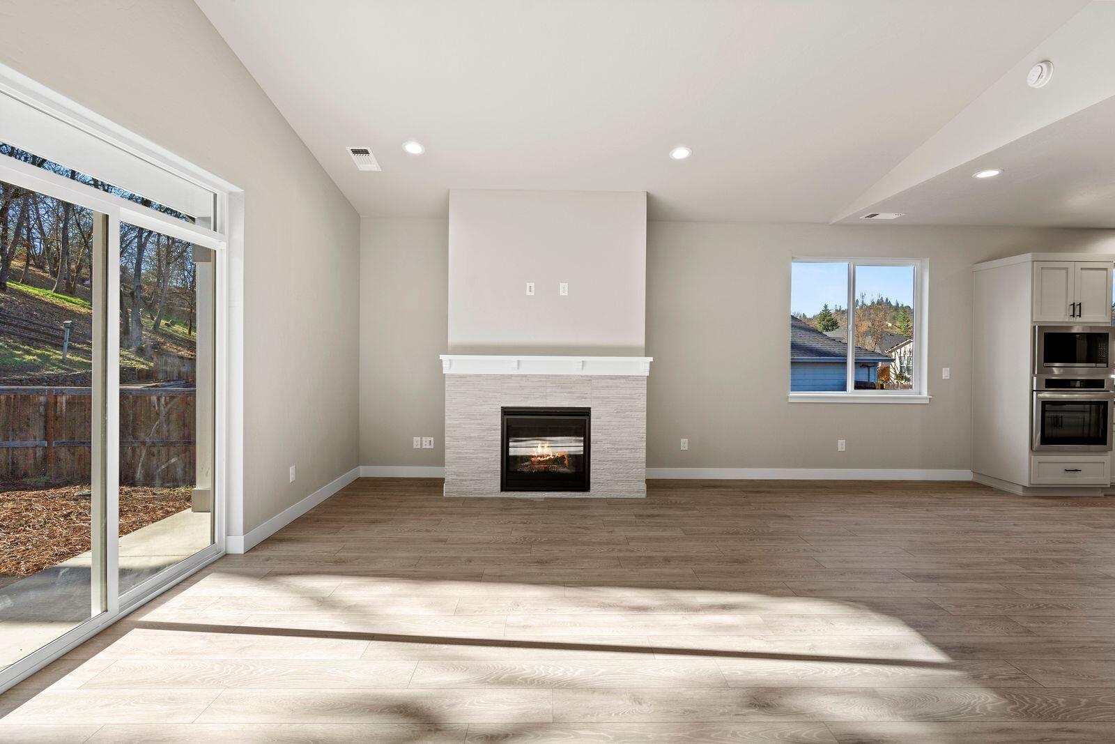 1135 Pumpkin Ridge, Unit 319 Eagle Point, OR 97524 - Photo 14 of 34 a view of a livingroom with a fireplace and window