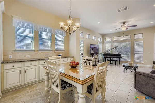 a view of a dining room with furniture window and outside view