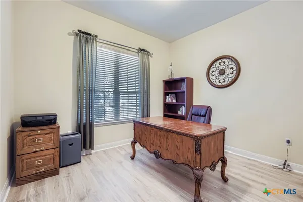 a room with furniture and a window