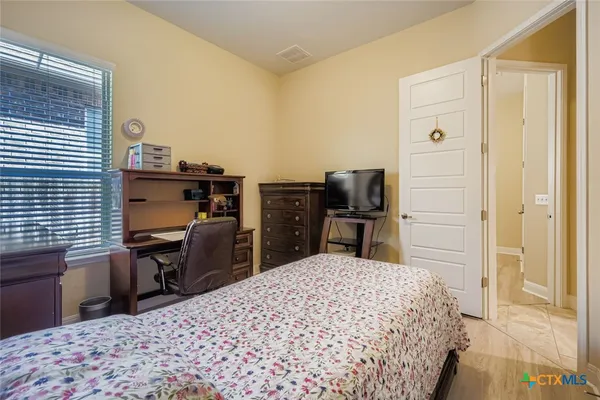 a bathroom with a sink vanity mirror and toilet