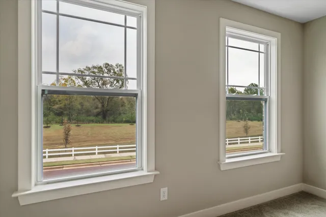 a view of a room that has a window in it