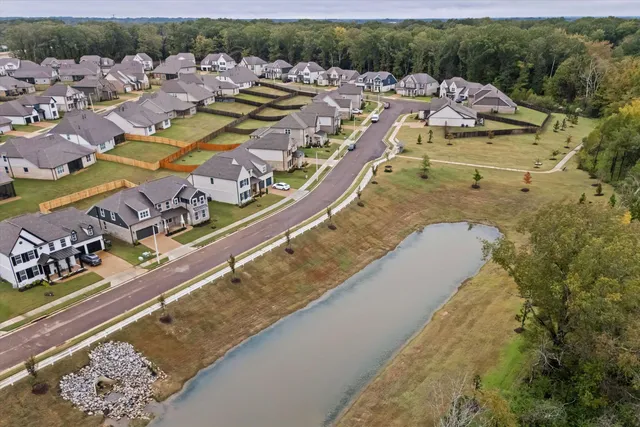 a view of a swimming pool with outdoor seating and mountain view