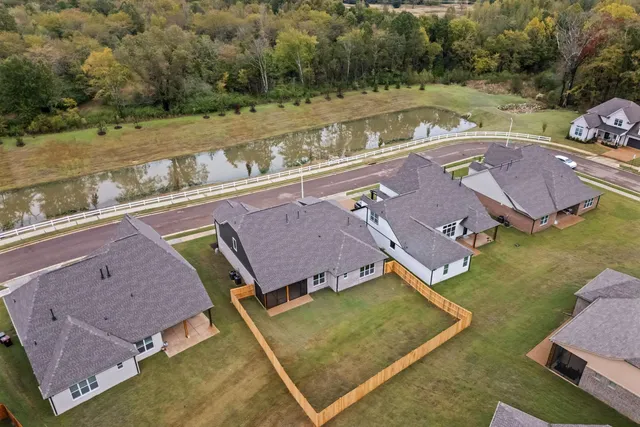 an aerial view of a house with pool