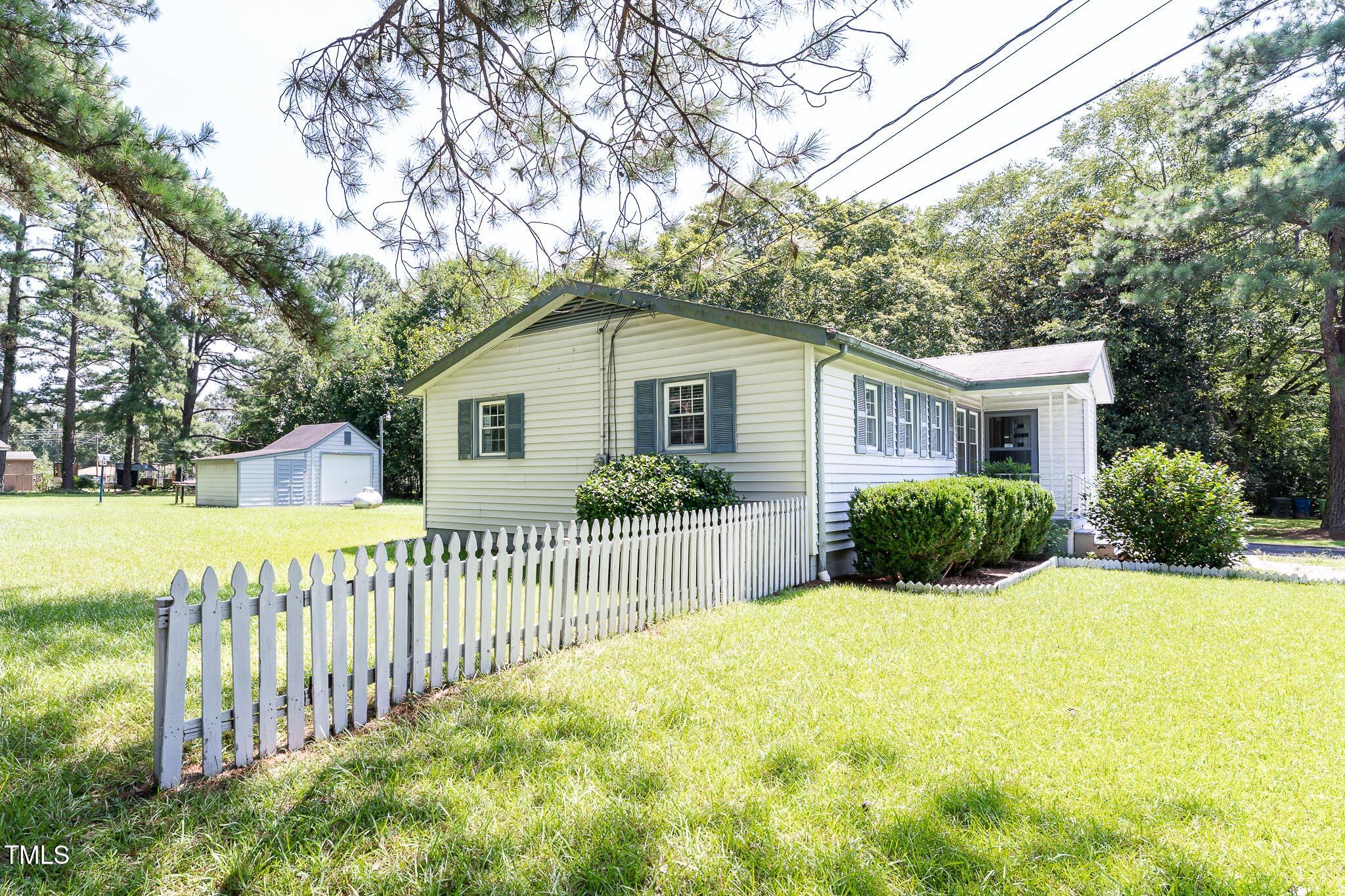 2809 Providence Road Raleigh, NC 27610 - Photo 11 of 39 a view of a house with wooden fence next to a yard