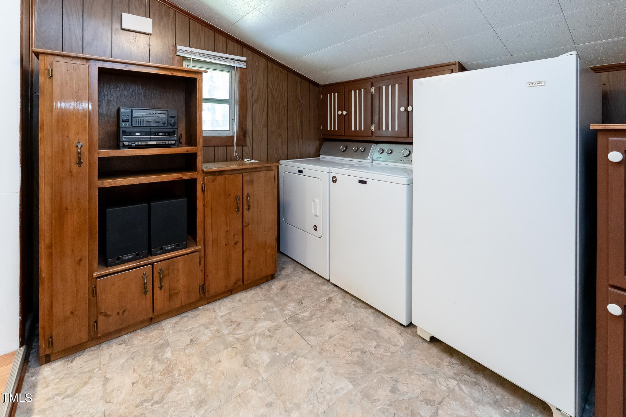 2809 Providence Road Raleigh, NC 27610 - Photo 17 of 39 a kitchen with granite countertop cabinets and refrigerator
