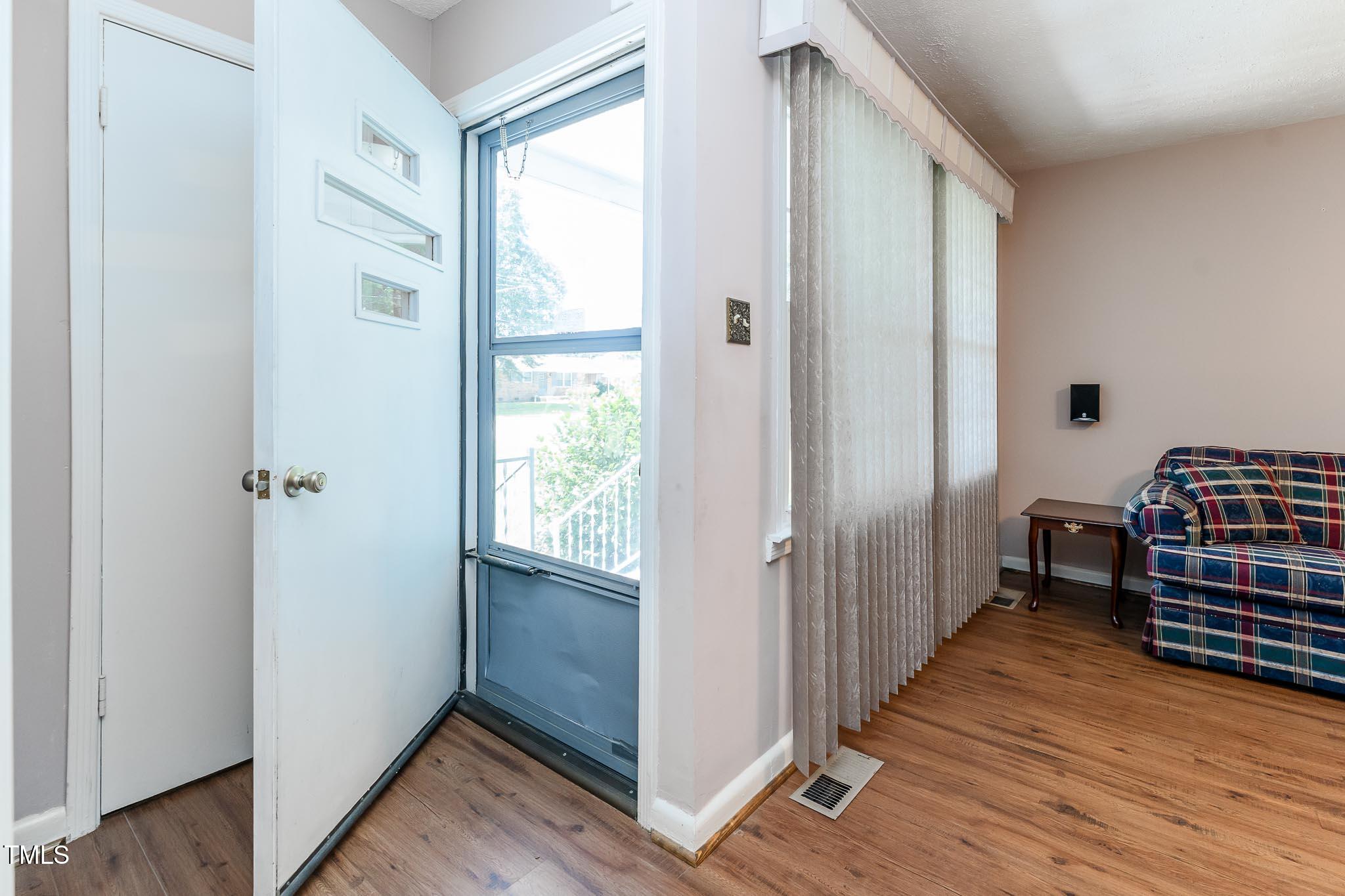 2809 Providence Road Raleigh, NC 27610 - Photo 22 of 39 a view of a room with wooden floor and staircase