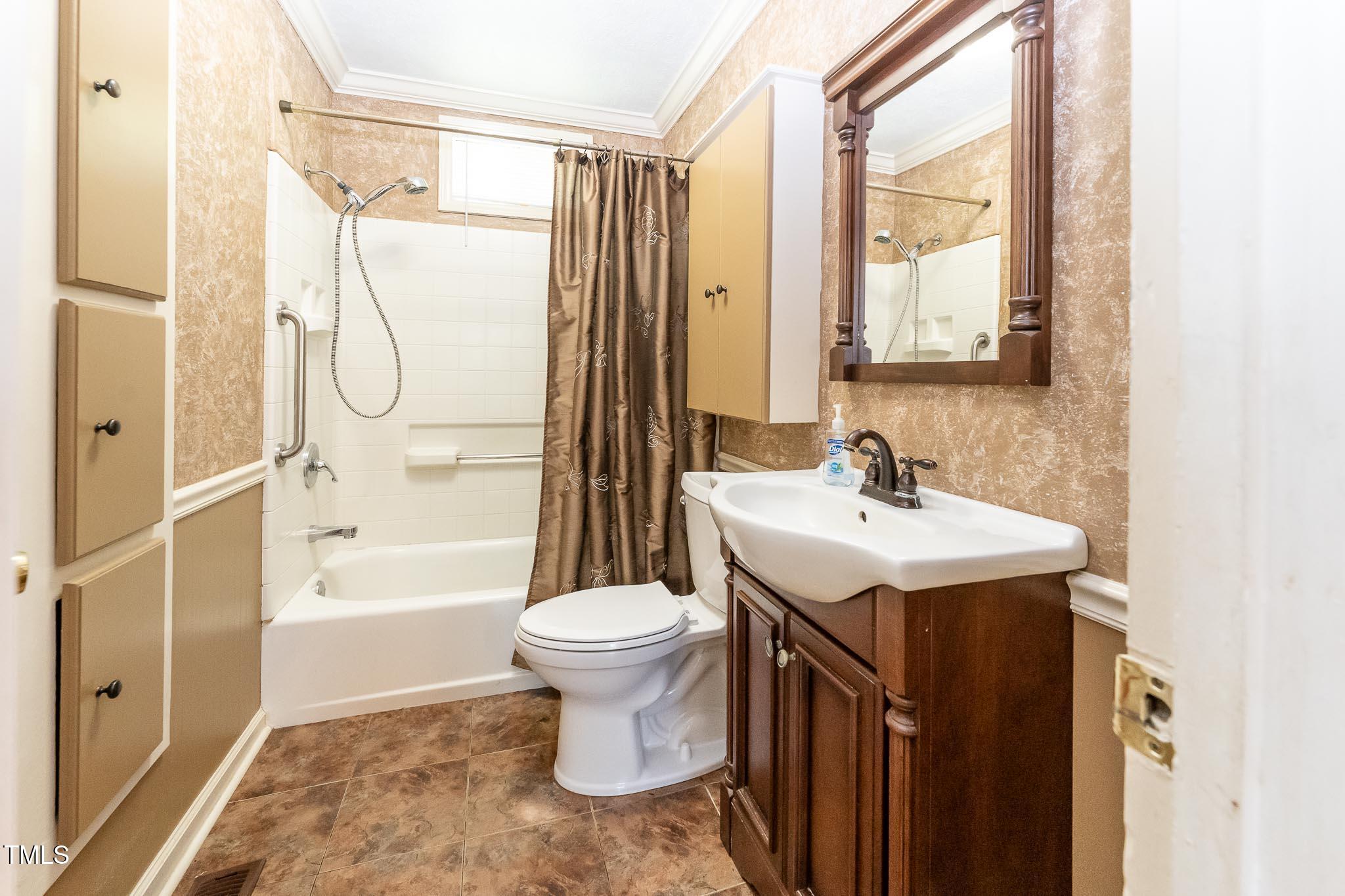 2809 Providence Road Raleigh, NC 27610 - Photo 25 of 39 a bathroom with a sink toilet and shower