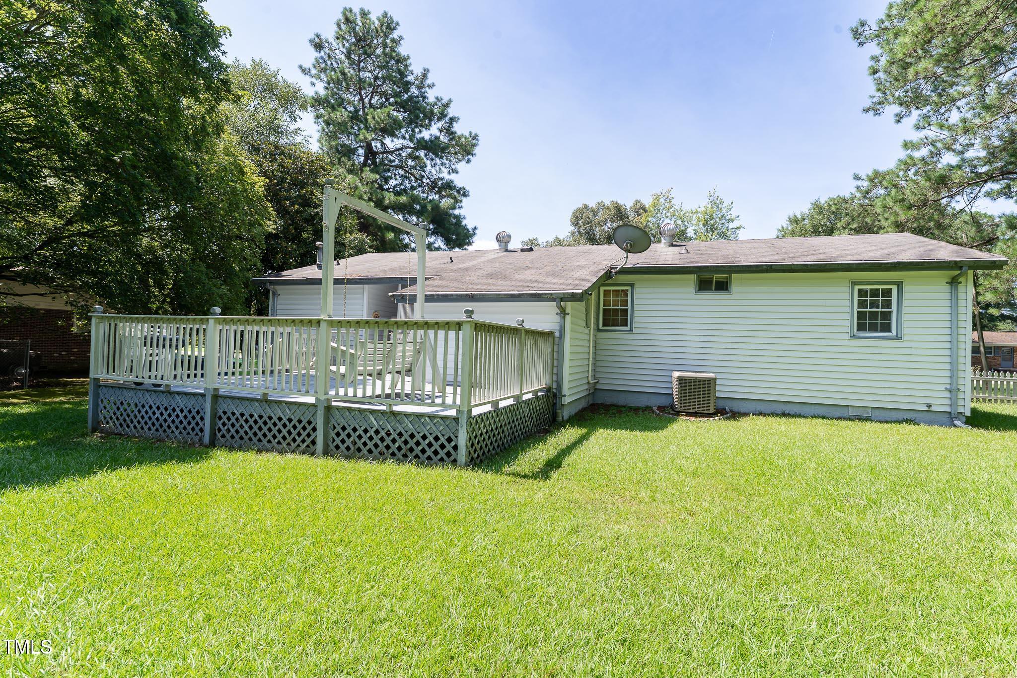 2809 Providence Road Raleigh, NC 27610 - Photo 5 of 39 a view of backyard with barbeque grill and wooden fence